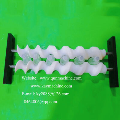 Special screws able to turn and place triangular bottles in the required regular position. Rotator for pucks